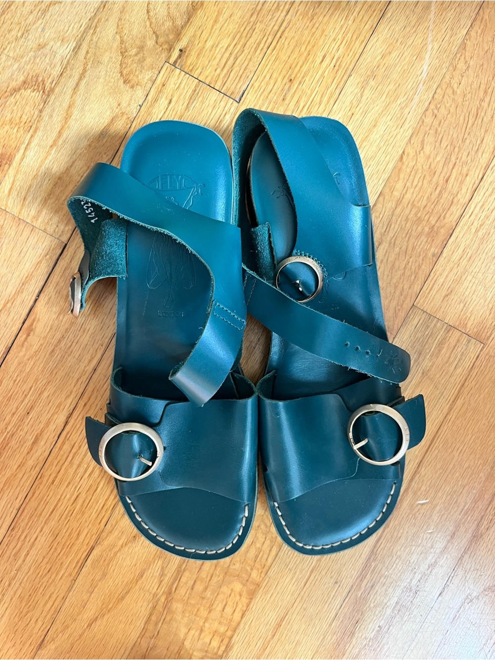 The fly London Women's Teal Leather Buckle Sandals